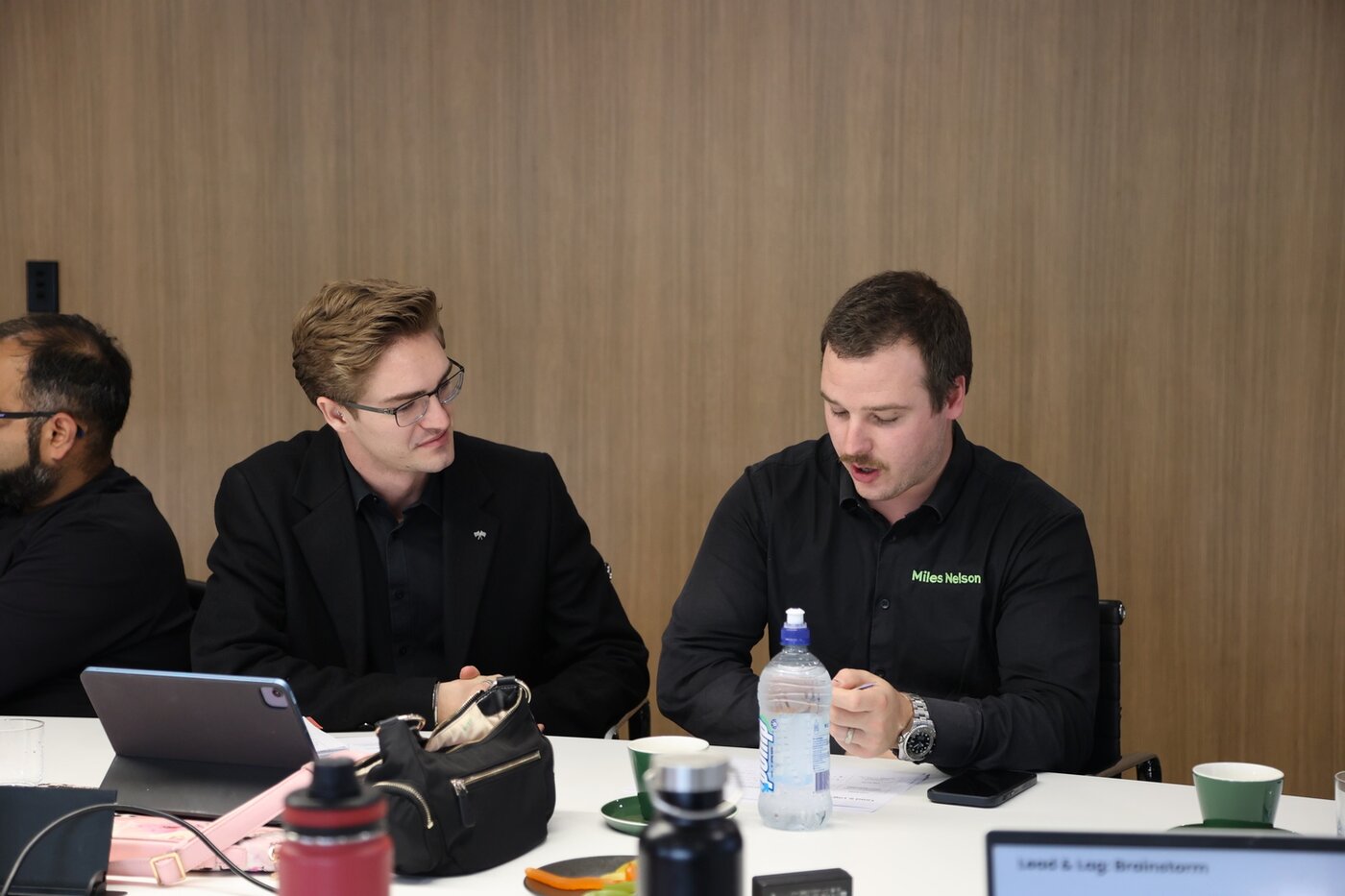 Sales reps working through the programme together at the table